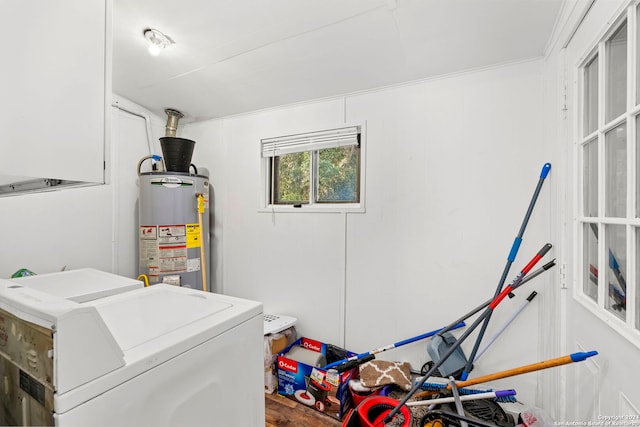 laundry area with independent washer and dryer and water heater