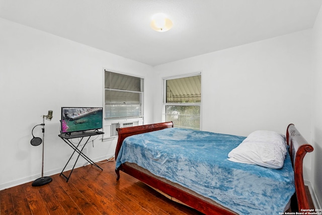 bedroom with wood-type flooring