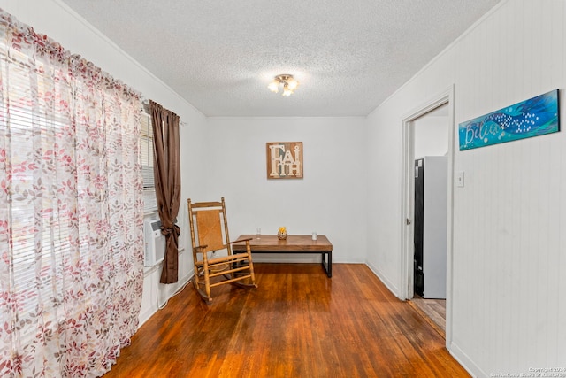 corridor with a textured ceiling, dark hardwood / wood-style floors, and cooling unit