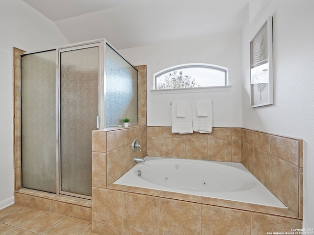 bathroom with a whirlpool tub, a shower stall, and tile patterned floors