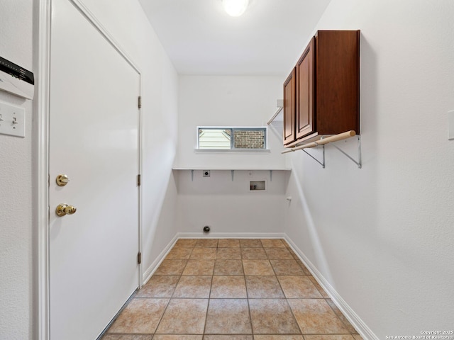 washroom with hookup for a washing machine, cabinet space, hookup for an electric dryer, and baseboards