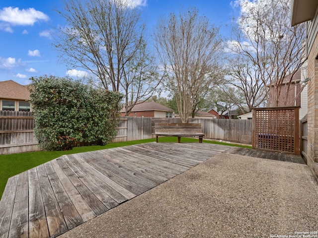 view of yard featuring a fenced backyard and a deck