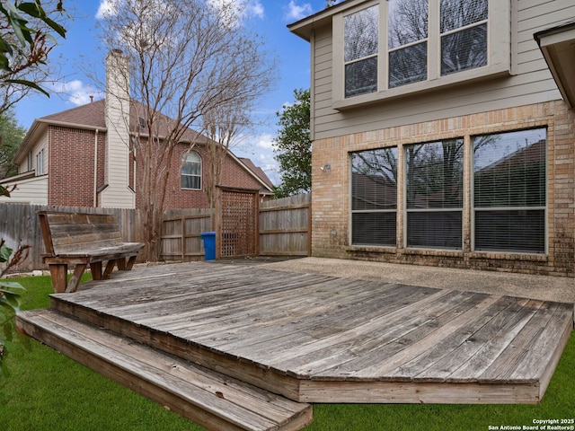 deck with a fenced backyard