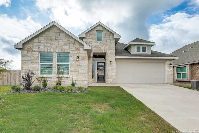 view of front of home featuring a garage and a front yard