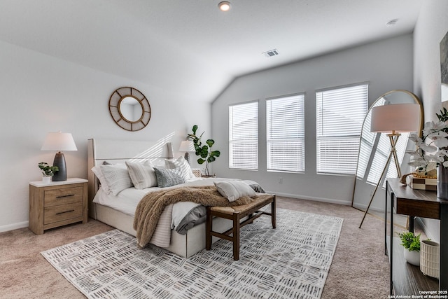 carpeted bedroom featuring vaulted ceiling