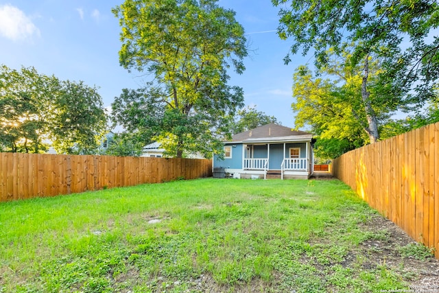 view of yard featuring covered porch