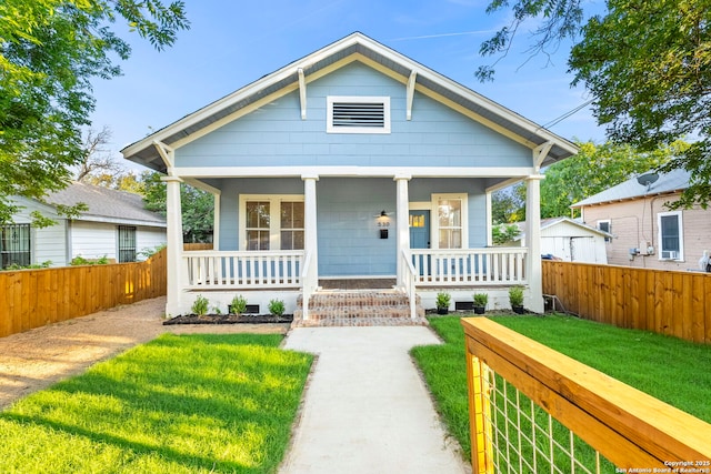 bungalow-style house featuring a front yard and a porch