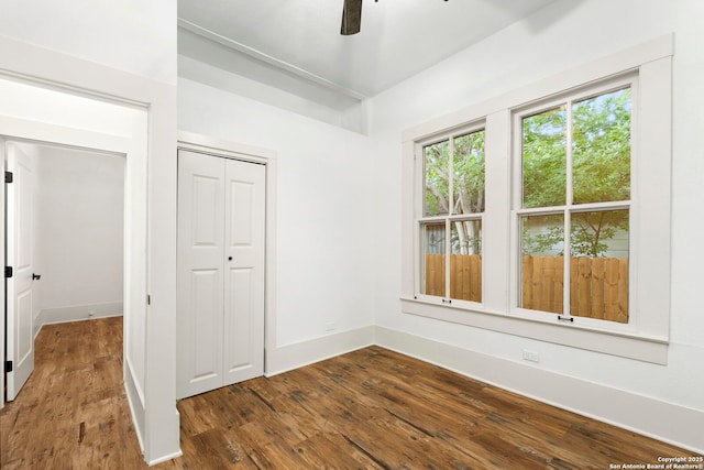 empty room featuring dark hardwood / wood-style floors and ceiling fan