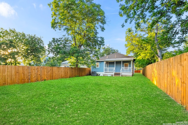 view of yard with covered porch