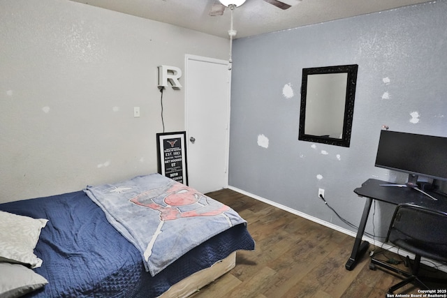 bedroom with ceiling fan and wood-type flooring