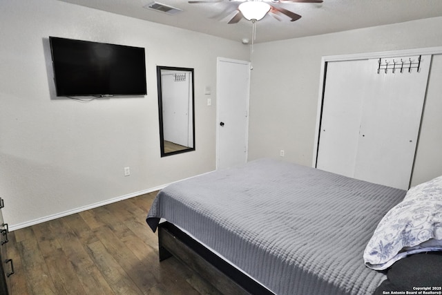 bedroom with ceiling fan and dark hardwood / wood-style flooring