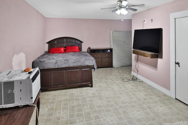 bedroom featuring ceiling fan and a wall unit AC