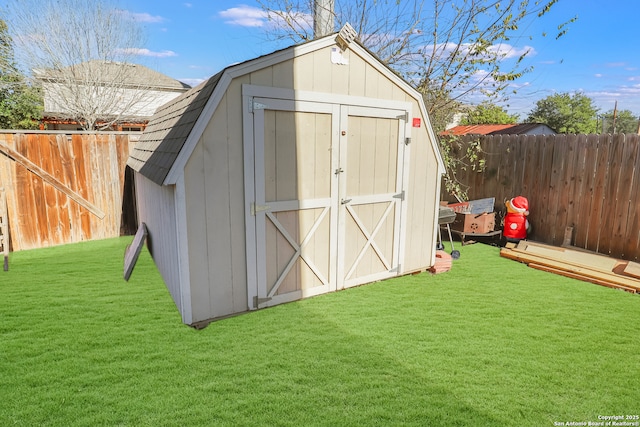 view of outbuilding with a lawn