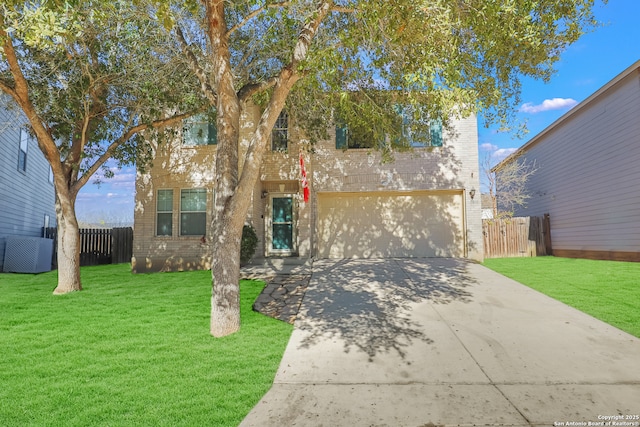 view of front facade with a front yard and a garage