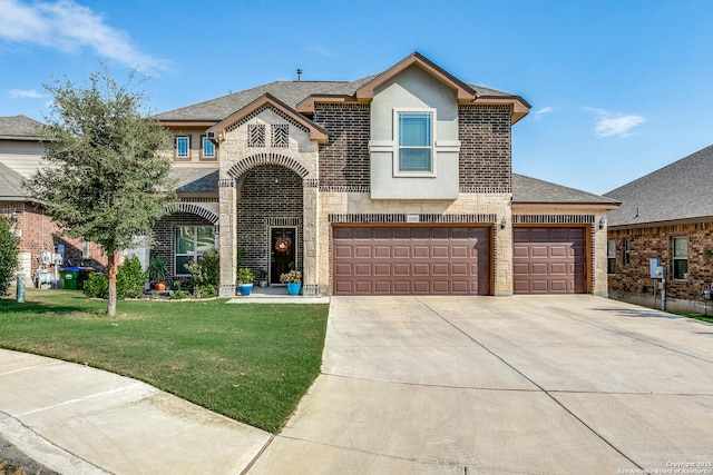 view of front of house featuring a garage and a front lawn