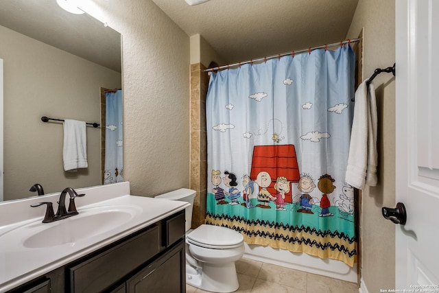 full bathroom with vanity, tile patterned floors, toilet, shower / bath combo with shower curtain, and a textured ceiling