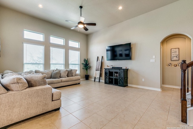 living room featuring ceiling fan and light tile patterned flooring