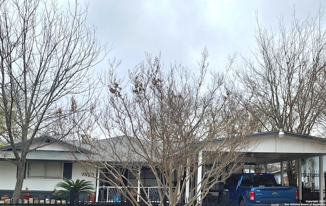 exterior space featuring a carport