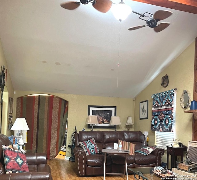 living room featuring vaulted ceiling and hardwood / wood-style flooring