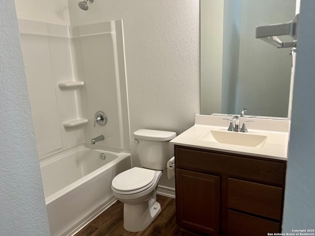 full bathroom featuring hardwood / wood-style floors, vanity,  shower combination, and toilet