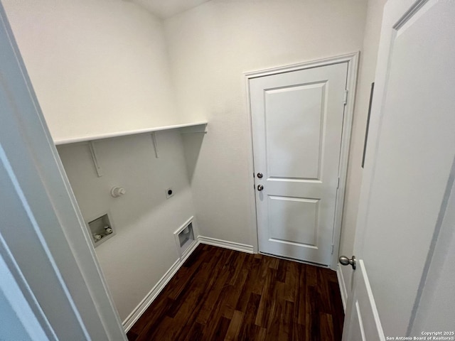 clothes washing area featuring hookup for an electric dryer and dark wood-type flooring