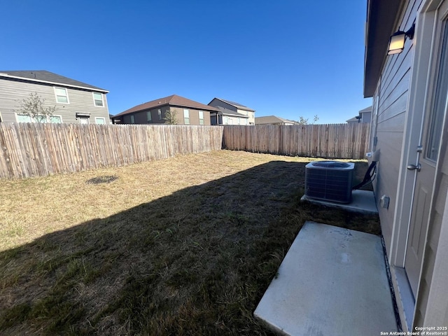 view of yard featuring central air condition unit