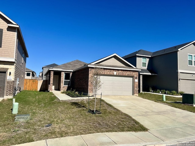 view of front facade with a front yard and a garage