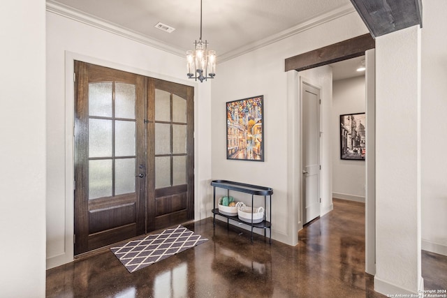 foyer featuring french doors, a chandelier, and ornamental molding