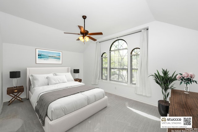 bedroom with lofted ceiling, carpet flooring, and ceiling fan