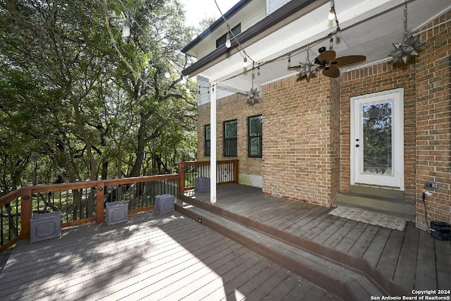 wooden deck featuring ceiling fan