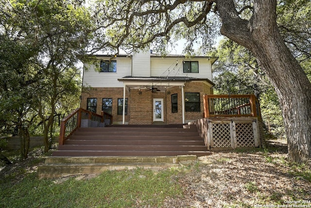 back of house with ceiling fan