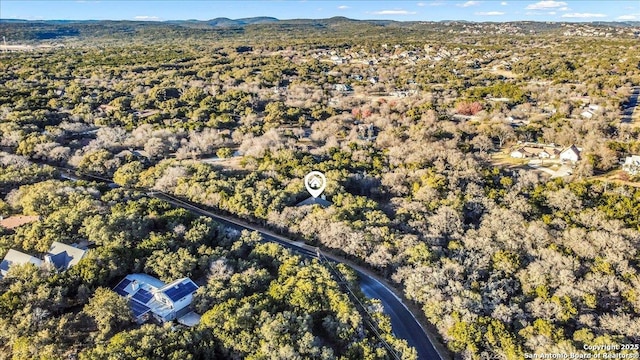 birds eye view of property with a mountain view