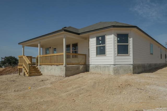 view of property exterior with a porch