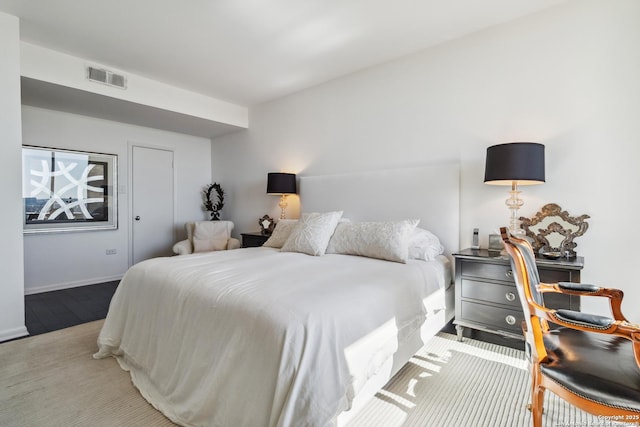 bedroom featuring light colored carpet