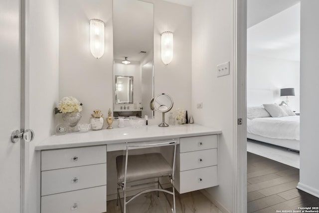 bathroom featuring hardwood / wood-style floors and vanity