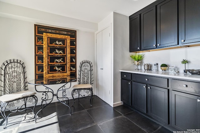 bar featuring dark tile patterned flooring