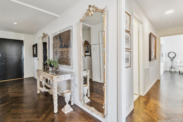 corridor with dark parquet floors