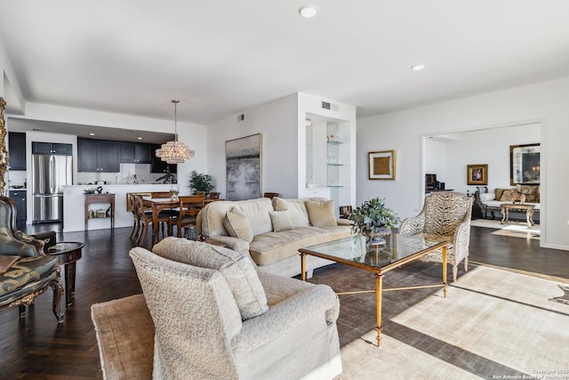 living room featuring dark parquet flooring