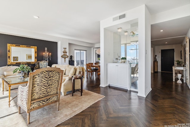 living room featuring dark parquet floors and plenty of natural light