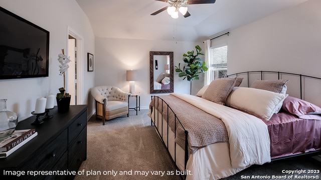 bedroom featuring carpet floors, vaulted ceiling, and ceiling fan