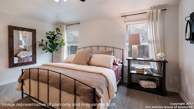 bedroom with dark colored carpet and ceiling fan