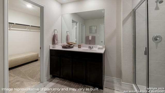 bathroom featuring vanity and walk in shower