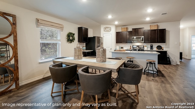 dining space with dark hardwood / wood-style floors