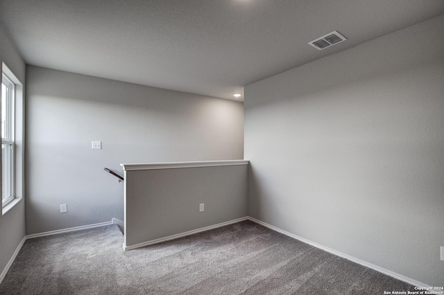 empty room featuring carpet floors