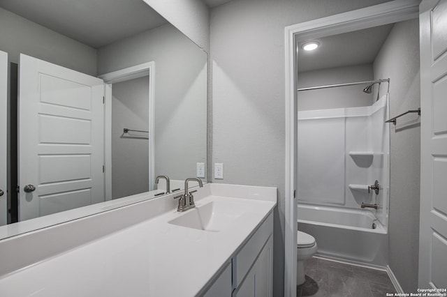 full bathroom with washtub / shower combination, vanity, and toilet