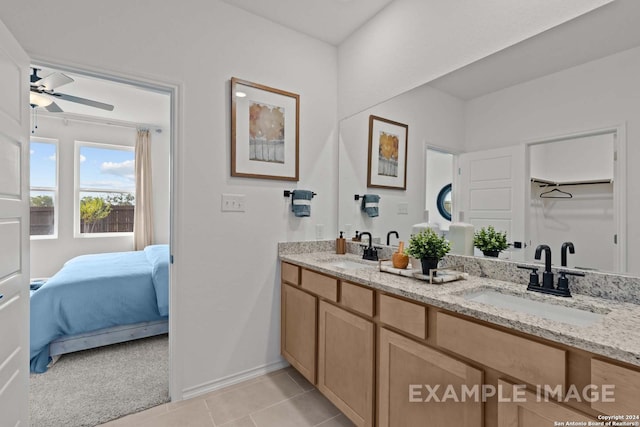 bathroom featuring tile patterned flooring, vanity, and ceiling fan