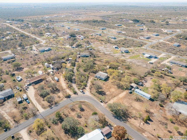 birds eye view of property featuring a rural view