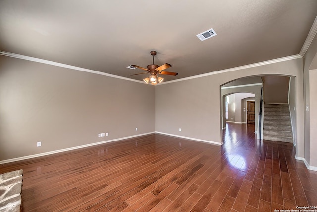 unfurnished room featuring dark hardwood / wood-style floors, ceiling fan, and ornamental molding