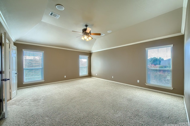 carpeted spare room featuring ceiling fan, lofted ceiling, and crown molding