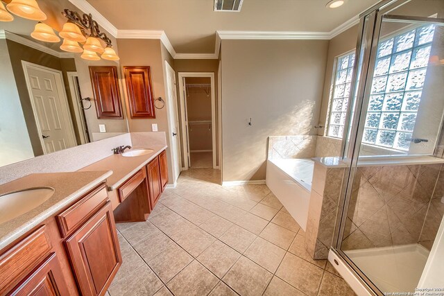 bathroom featuring tile patterned floors, vanity, separate shower and tub, and ornamental molding